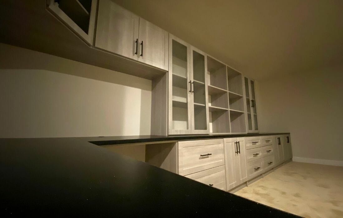 Home office long desk glass uppers, installed by Closets For Less