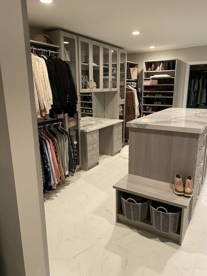 Walk-in closet island bench marble floor, installed by Closets For Less