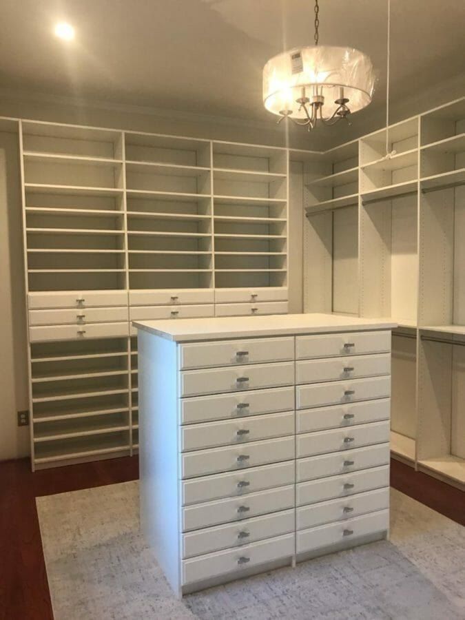 Walk-in closet island chandelier, installed by Closets For Less